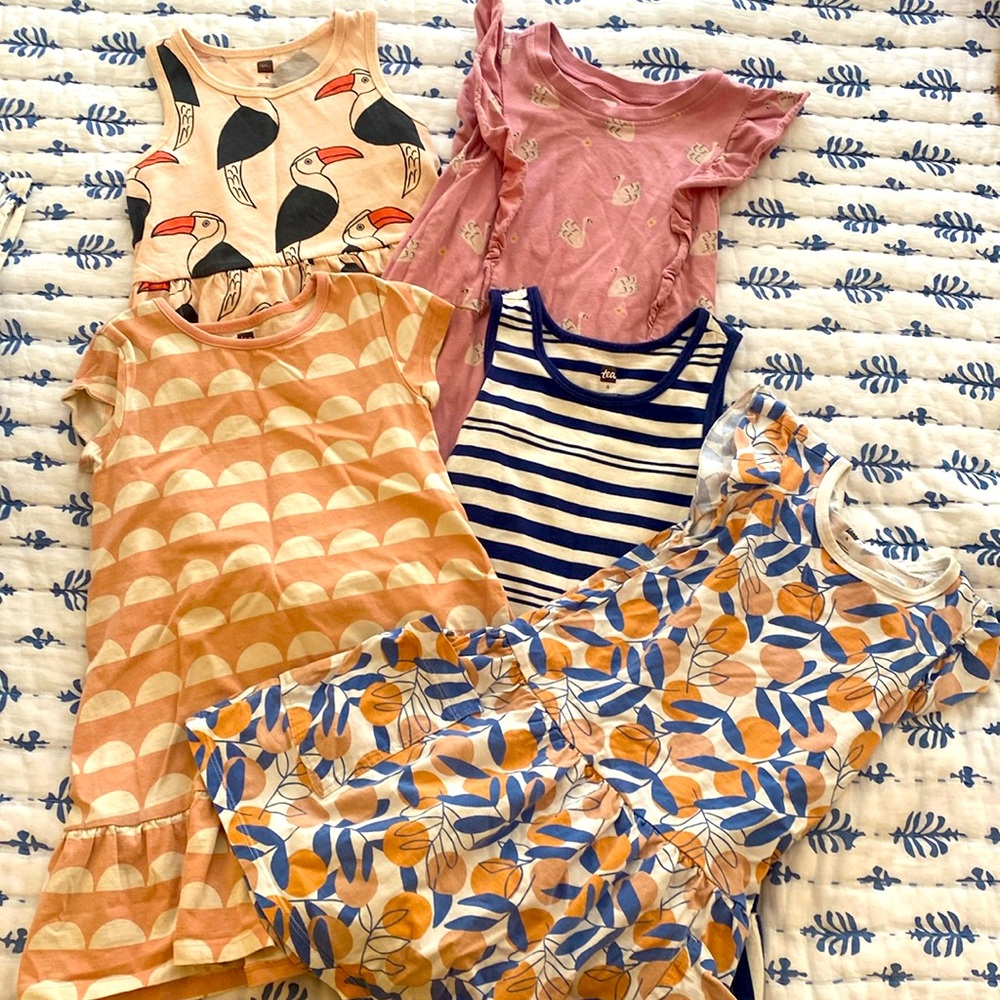 Lot of five size 5 Tea Collection cotton dresses in used play to good condition.